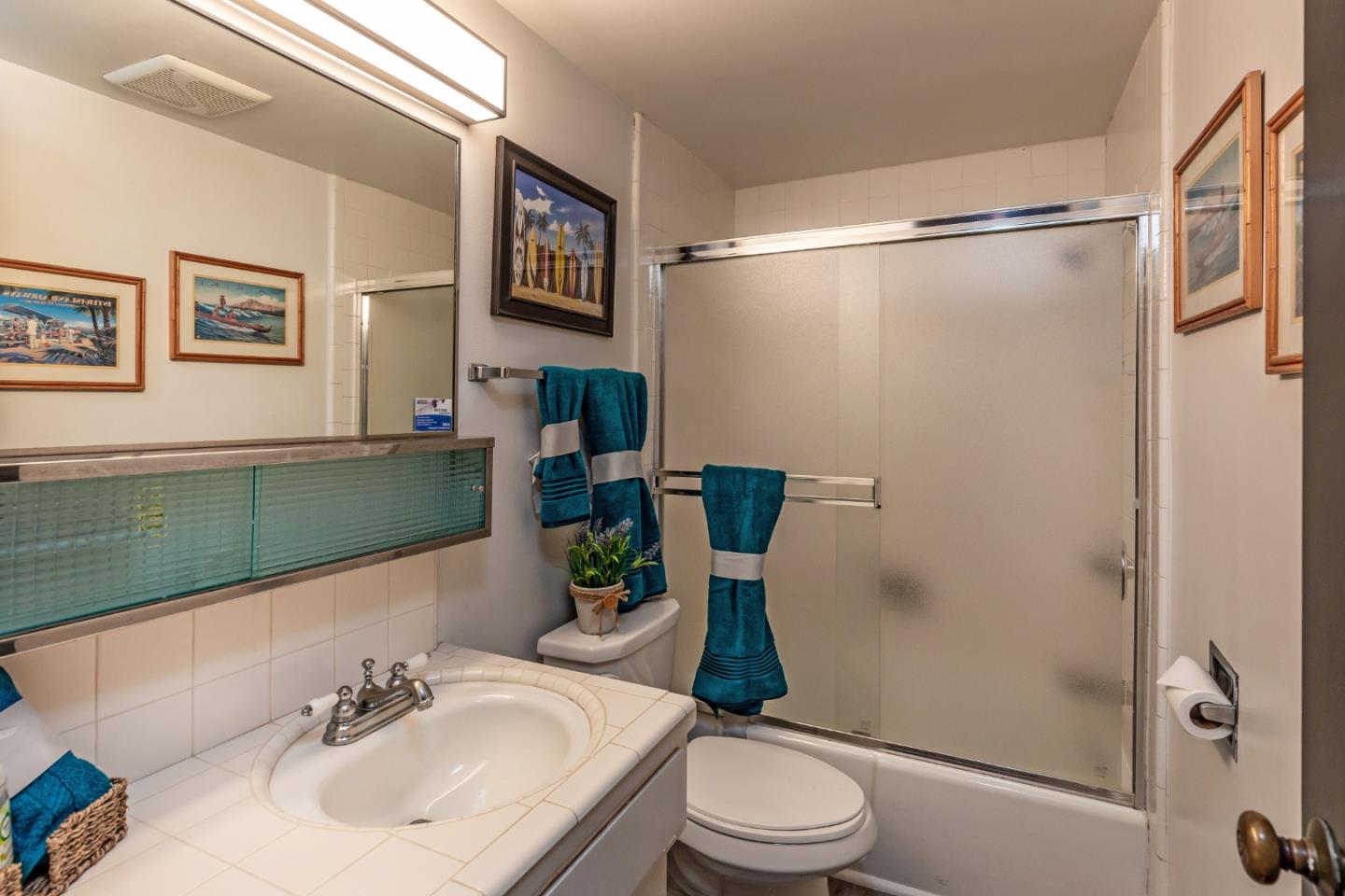 638 Beach Drive Aptos, CA 95003 - Photo 31 of 40 a bathroom with a sink toilet and shower