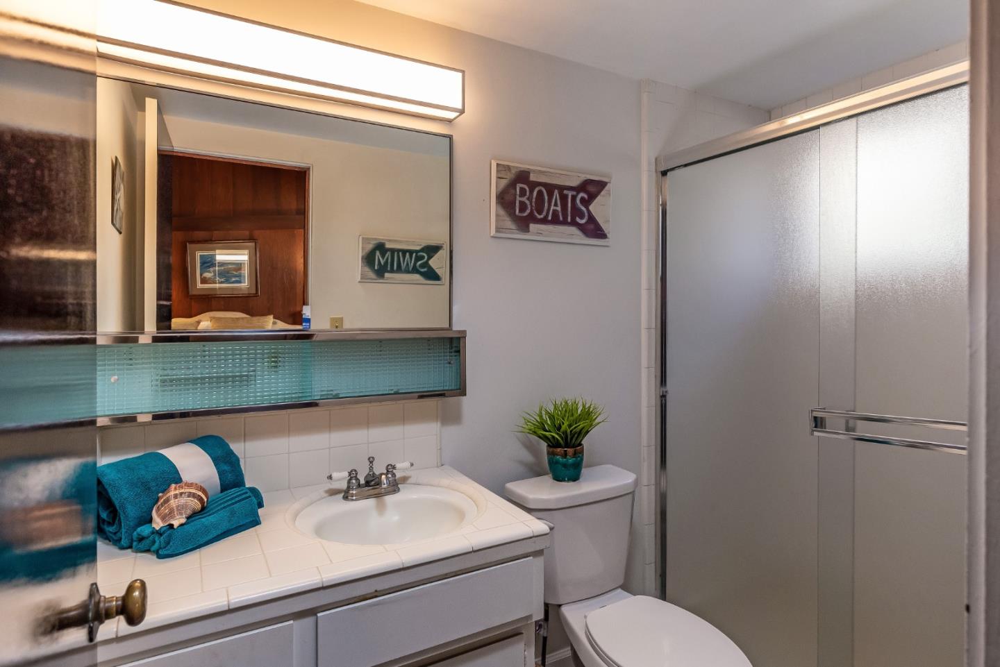 638 Beach Drive Aptos, CA 95003 - Photo 33 of 40 a bathroom with a sink and a mirror