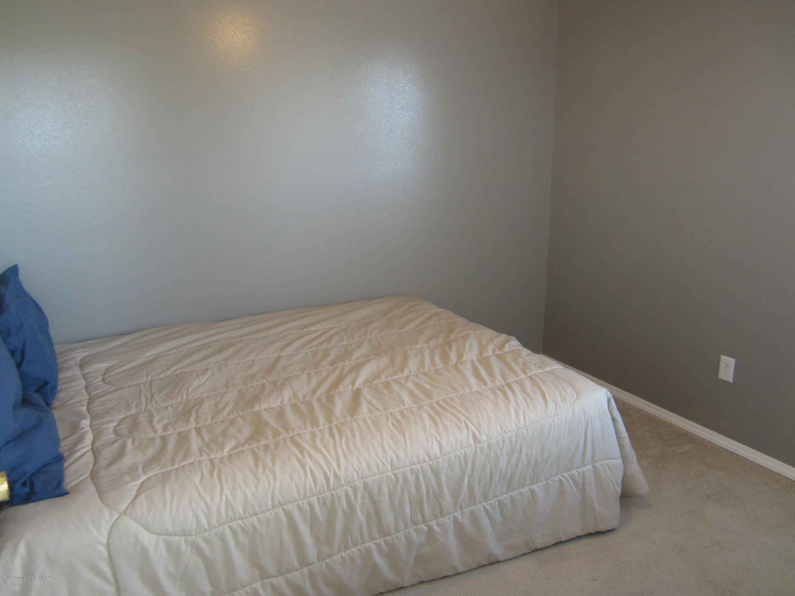 4724 Capulin Lane Amarillo, TX 79110 - Photo 15 of 23 a close up of a bed
