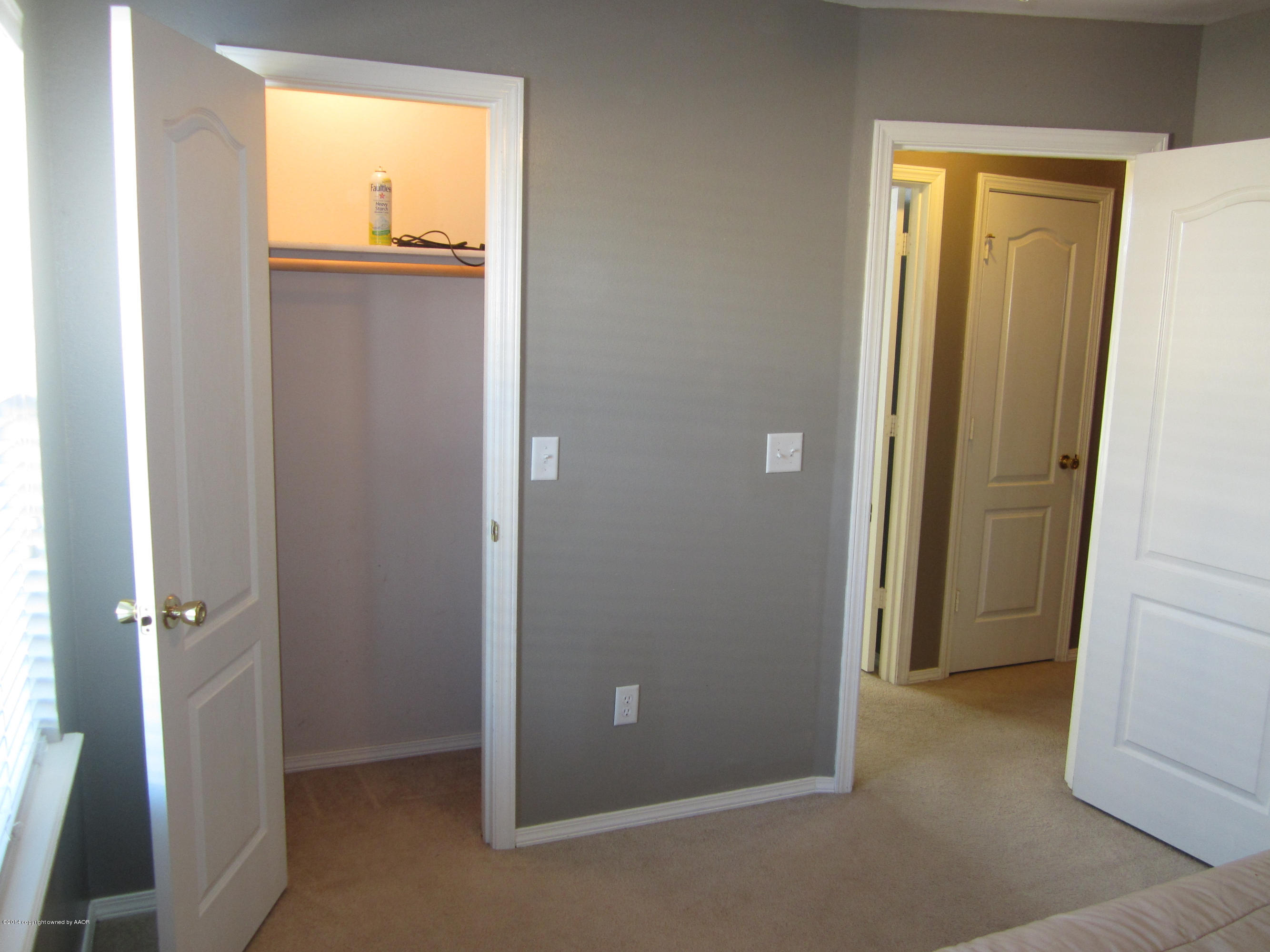 4724 Capulin Lane Amarillo, TX 79110 - Photo 16 of 23 an empty room with windows and closet