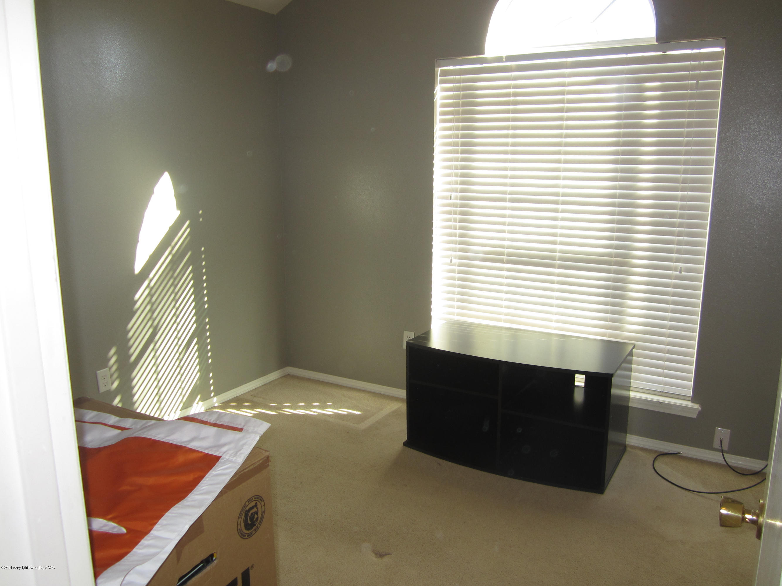 4724 Capulin Lane Amarillo, TX 79110 - Photo 19 of 23 a bathroom with a sink and a vanity