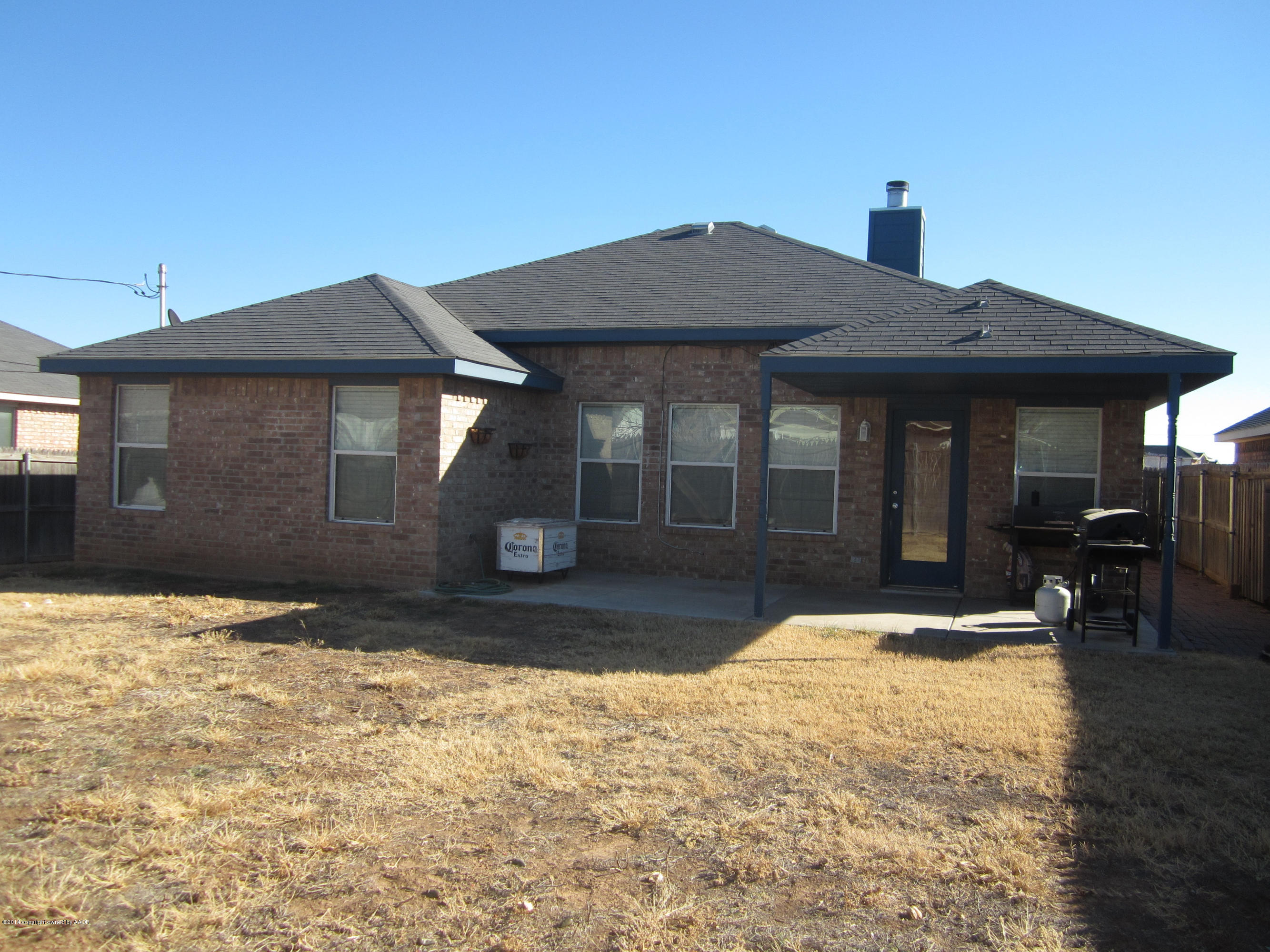 4724 Capulin Lane Amarillo, TX 79110 - Photo 21 of 23 a front view of a house with a yard