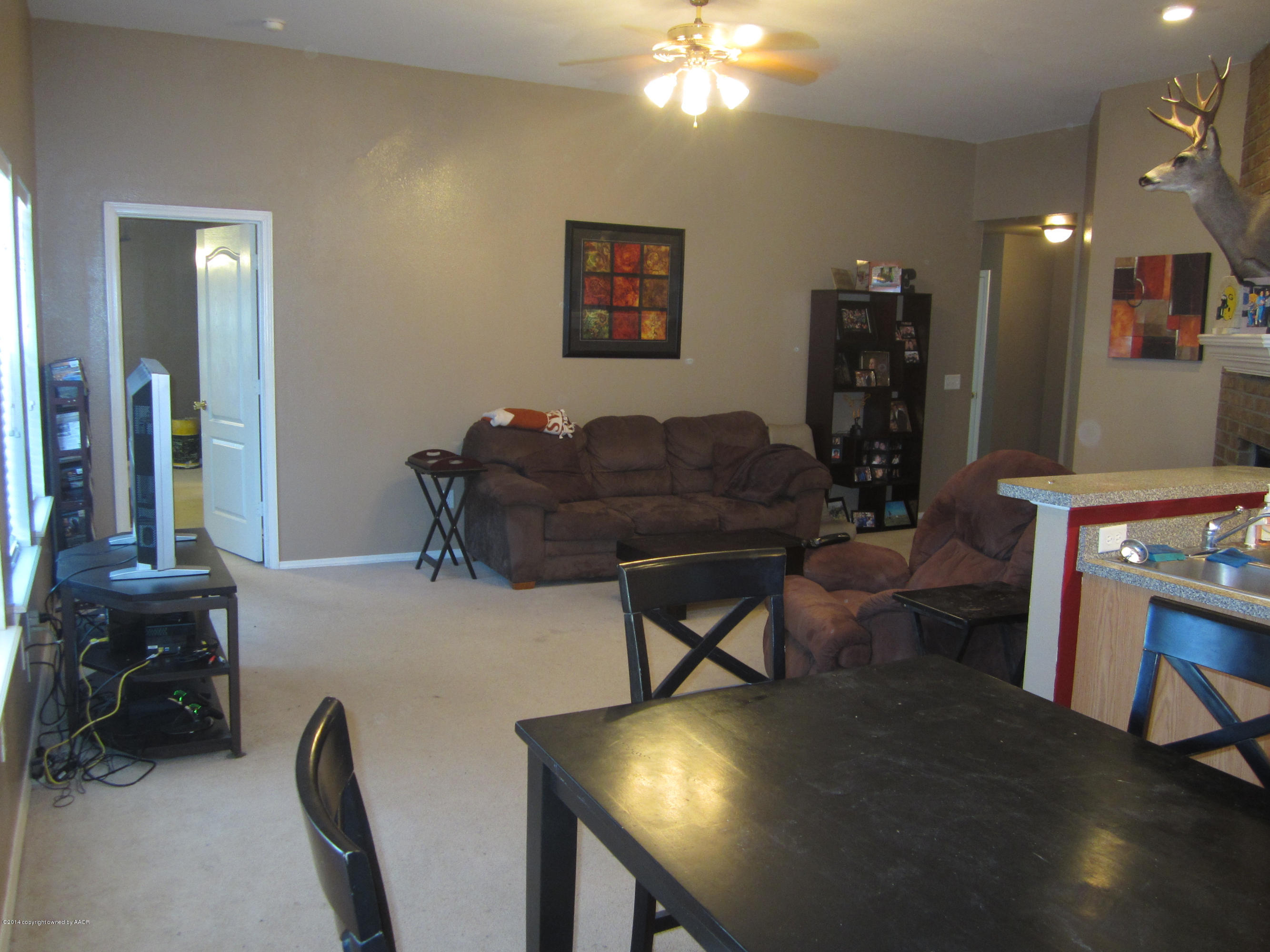 4724 Capulin Lane Amarillo, TX 79110 - Photo 5 of 23 a workspace with furniture and chandelier