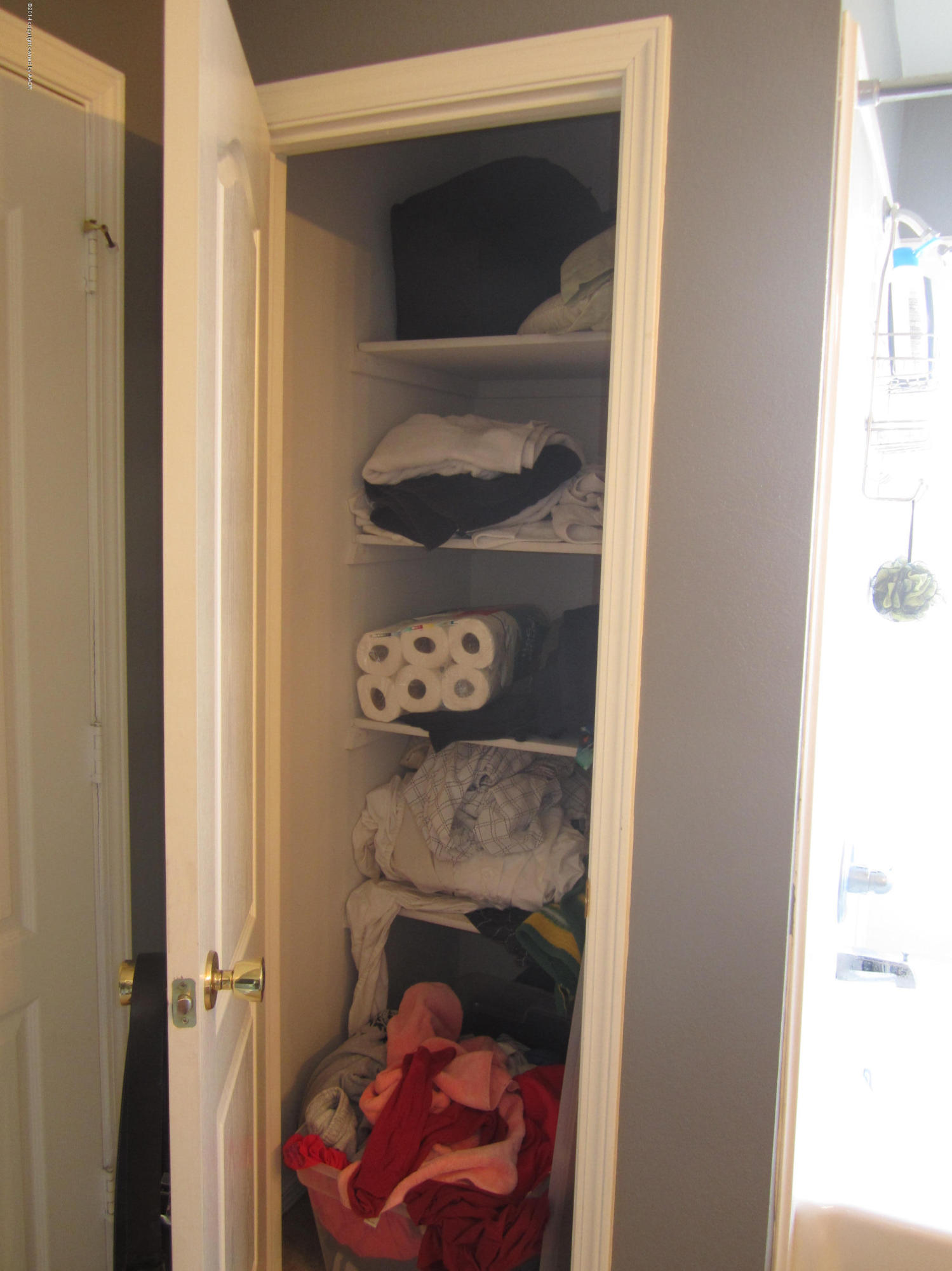 4724 Capulin Lane Amarillo, TX 79110 - Photo 7 of 23 a room with a walk in closet and a window