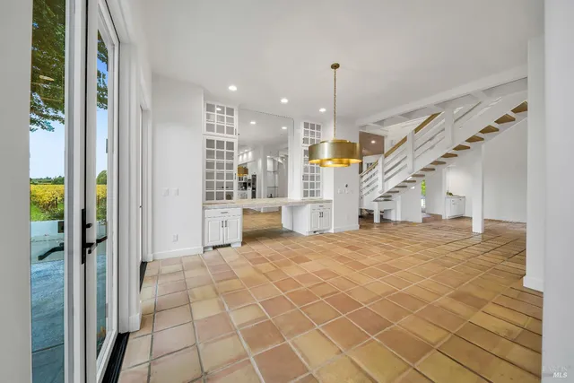 a view of entryway and kitchen