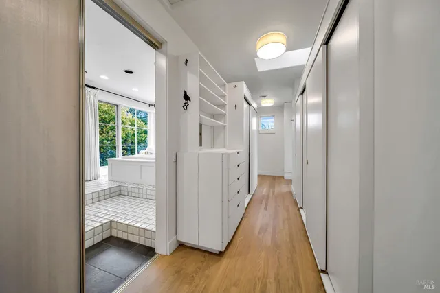 a view of a bathroom with a tub and shower