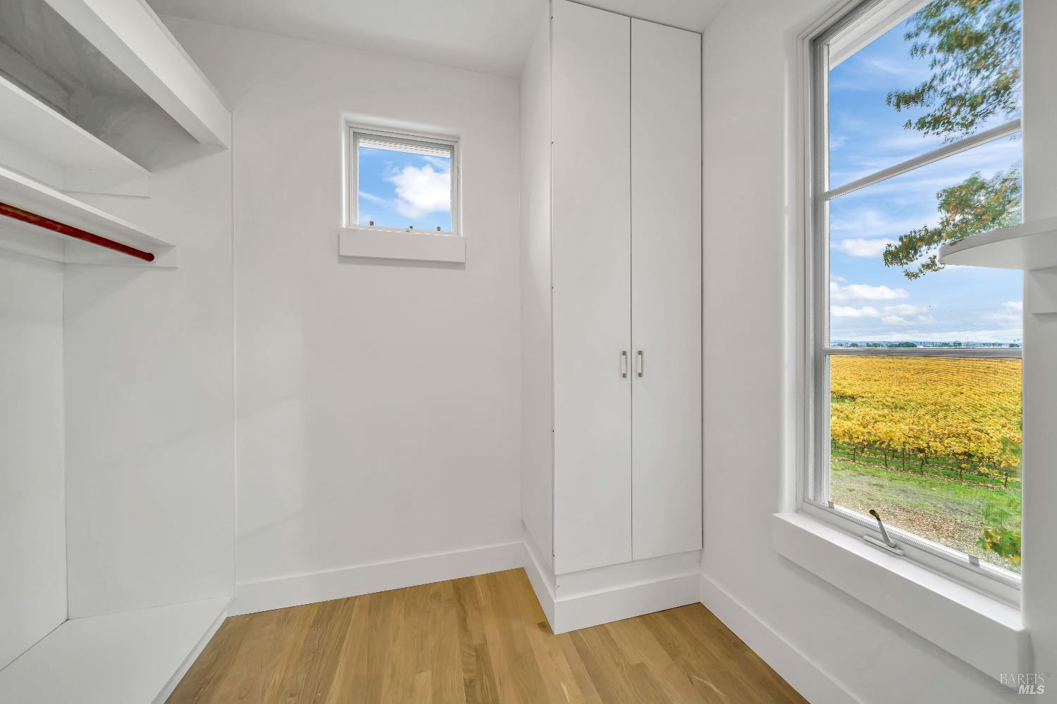 1041 Las Amigas Road Napa, CA 94559 - Photo 32 of 46 a view of room with window and wooden floor