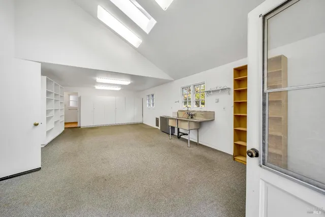 a view of an empty room with closet