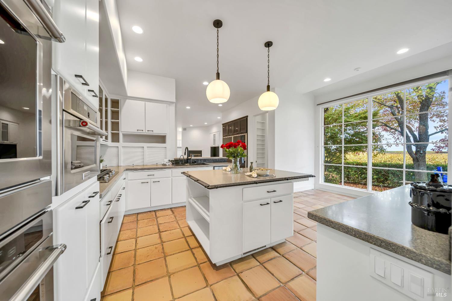 1041 Las Amigas Road Napa, CA 94559 - Photo 9 of 46 a large kitchen with lots of counter space windows and appliances