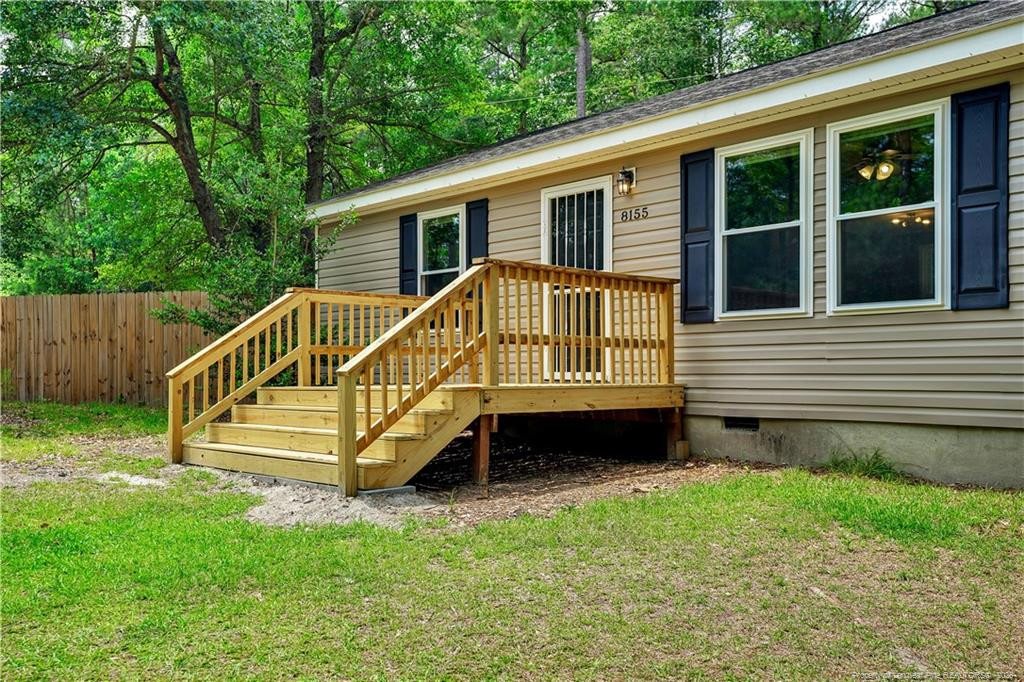8155 Arabia Road Lumber Bridge, NC 28357 - Photo 3 of 30 a front view of a house with a yard