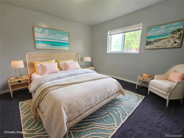 a bedroom with a bed and a couch