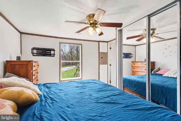 a bedroom with a bed and a dresser