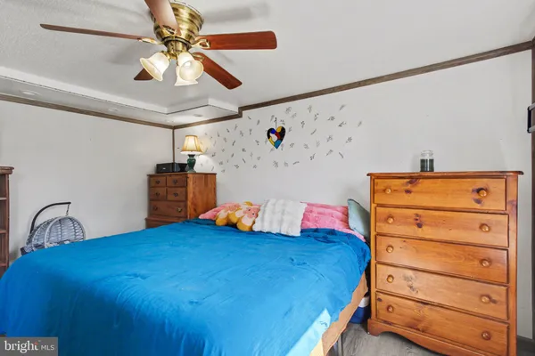 a bedroom with bed and a window