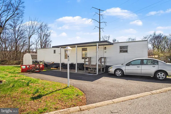 a view of a cars park in front of a house