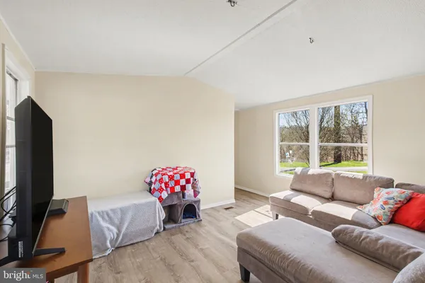 a kitchen with stainless steel appliances granite countertop sink stove top oven table and chairs