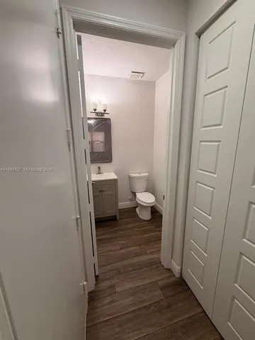 a bathroom with a sink and toilet