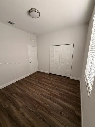 a view of a livingroom with wooden floor