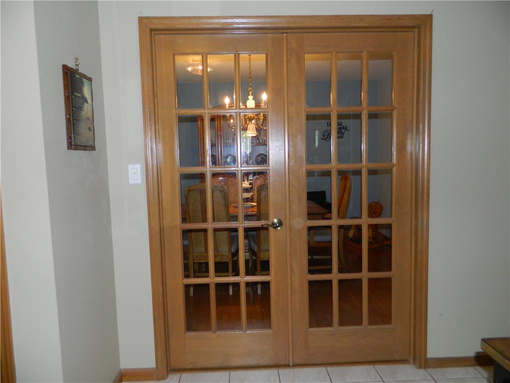 328 Pin Oak Road Stroudsburg, PA 18360 - Photo 11 of 37 French doors with windowpanes reveal an inviting dining space.