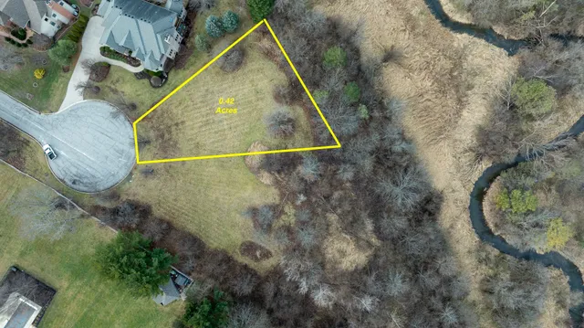 an aerial view of swimming pool a patio and mountain view