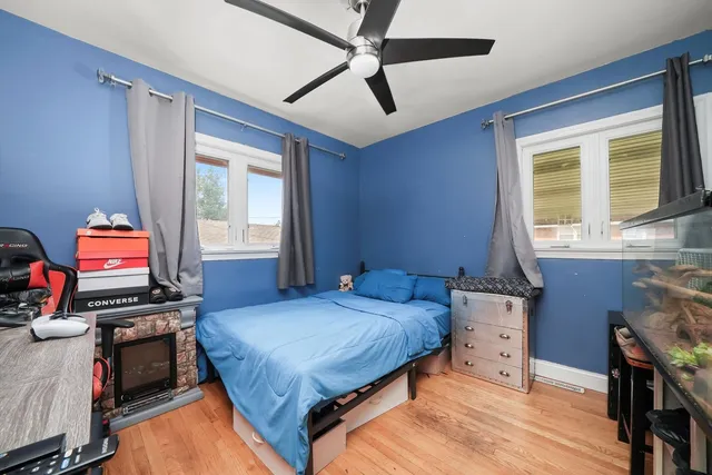 a bedroom with bed and a window