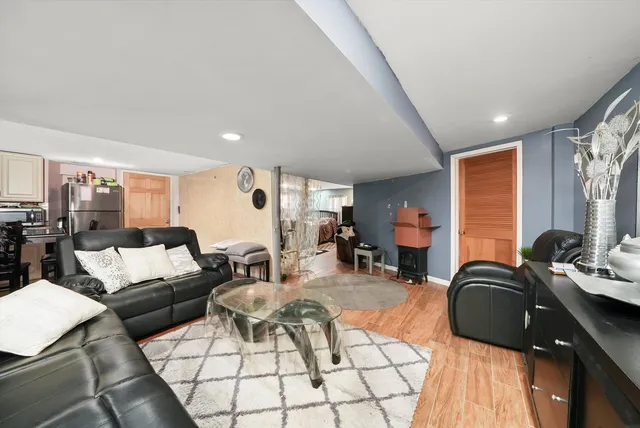 a living room with furniture a rug and a large window