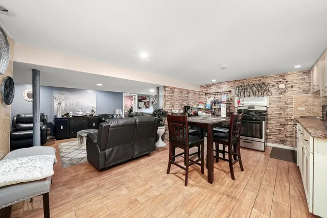 a view of a dining room with furniture and wooden floor