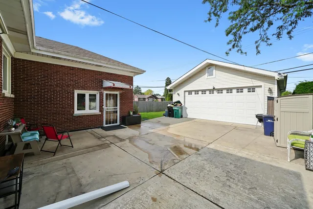 a view of a house with outdoor space and sitting area