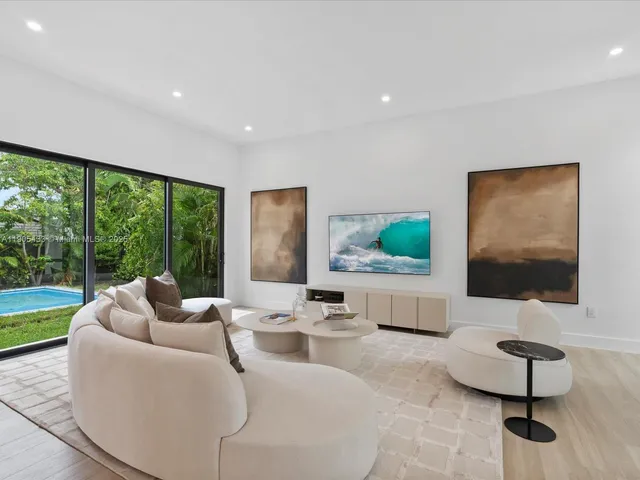 a kitchen with stainless steel appliances kitchen island granite countertop a sink and cabinets