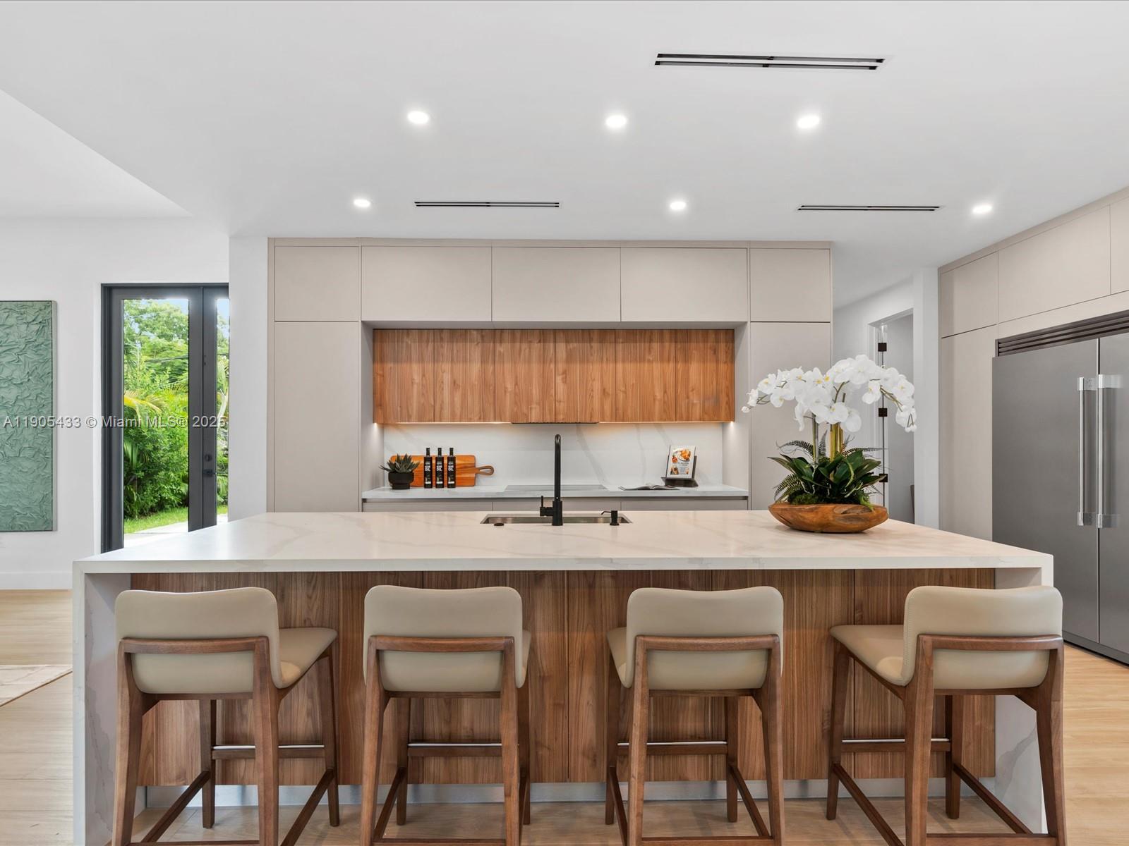1259 Southwest 20th Street Miami, FL 33145 - Photo 21 of 61 a kitchen with a table and chairs in it