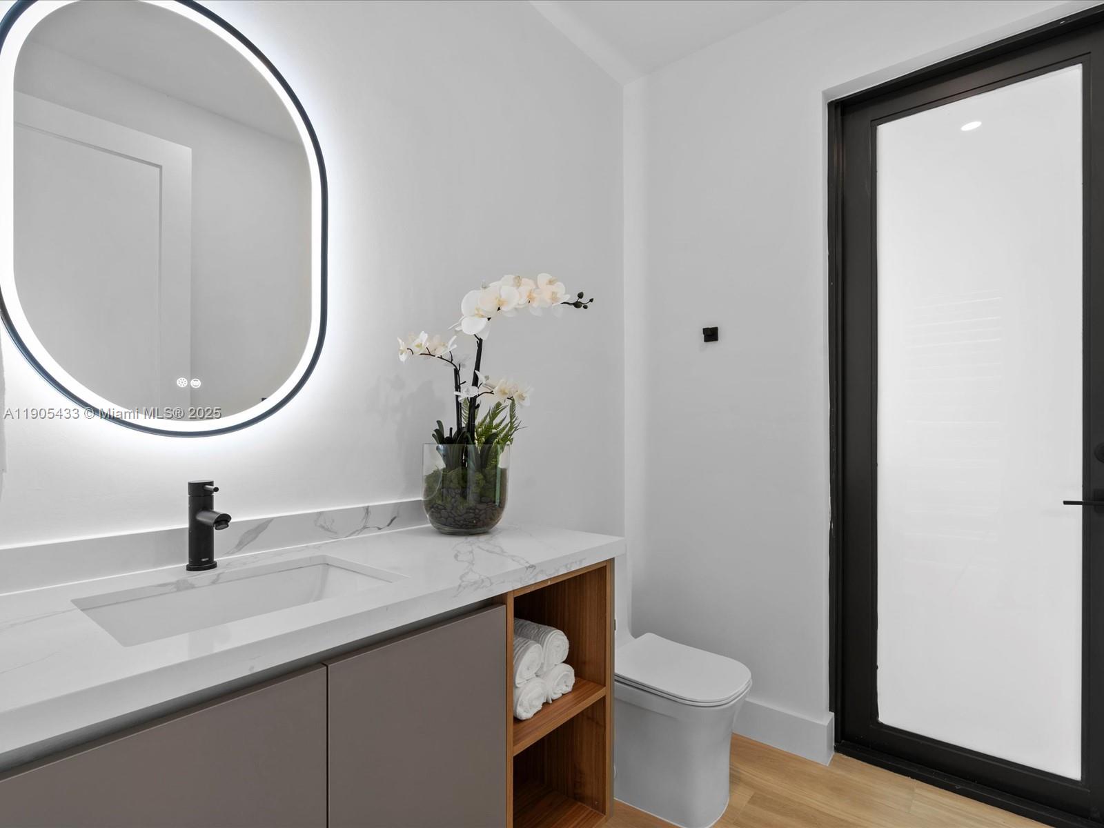 1259 Southwest 20th Street Miami, FL 33145 - Photo 29 of 61 a bathroom with a toilet and a mirror