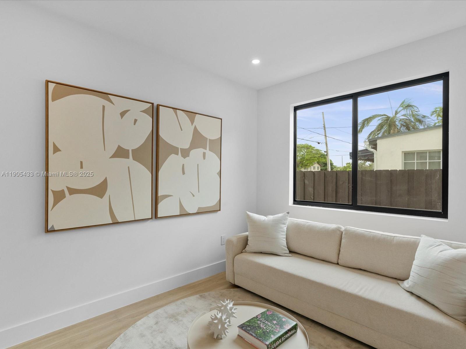 1259 Southwest 20th Street Miami, FL 33145 - Photo 34 of 61 a living room with furniture and a large window