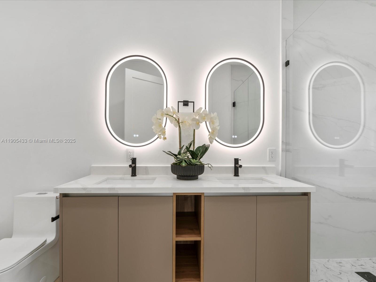 1259 Southwest 20th Street Miami, FL 33145 - Photo 42 of 61 a bathroom with a double vanity sink and a mirror