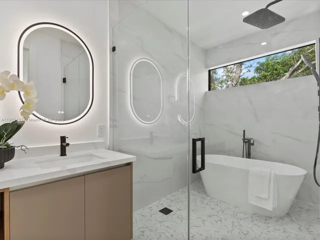 an empty room with wooden floor and window