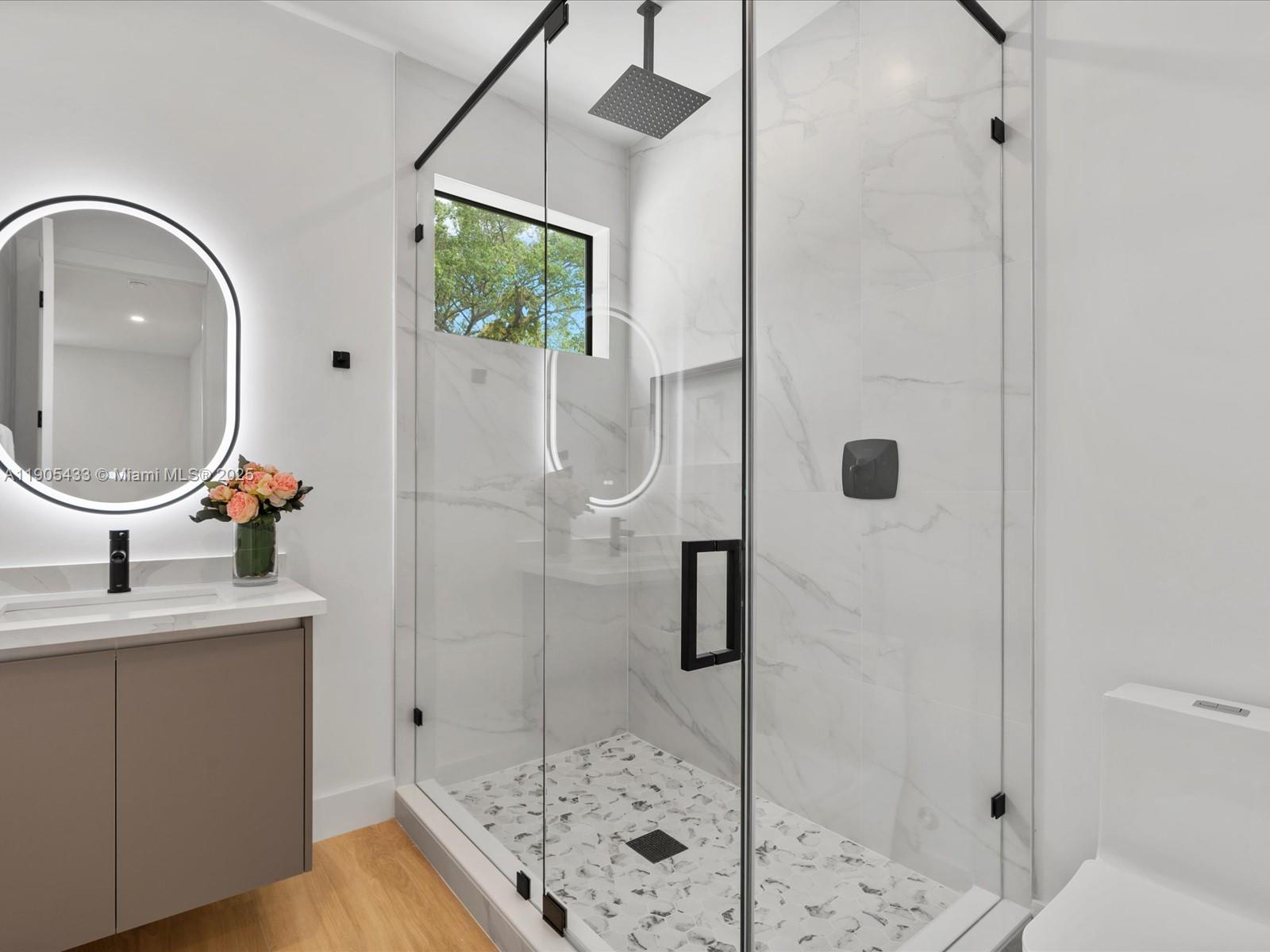 1259 Southwest 20th Street Miami, FL 33145 - Photo 50 of 61 a bathroom with a sink and a mirror