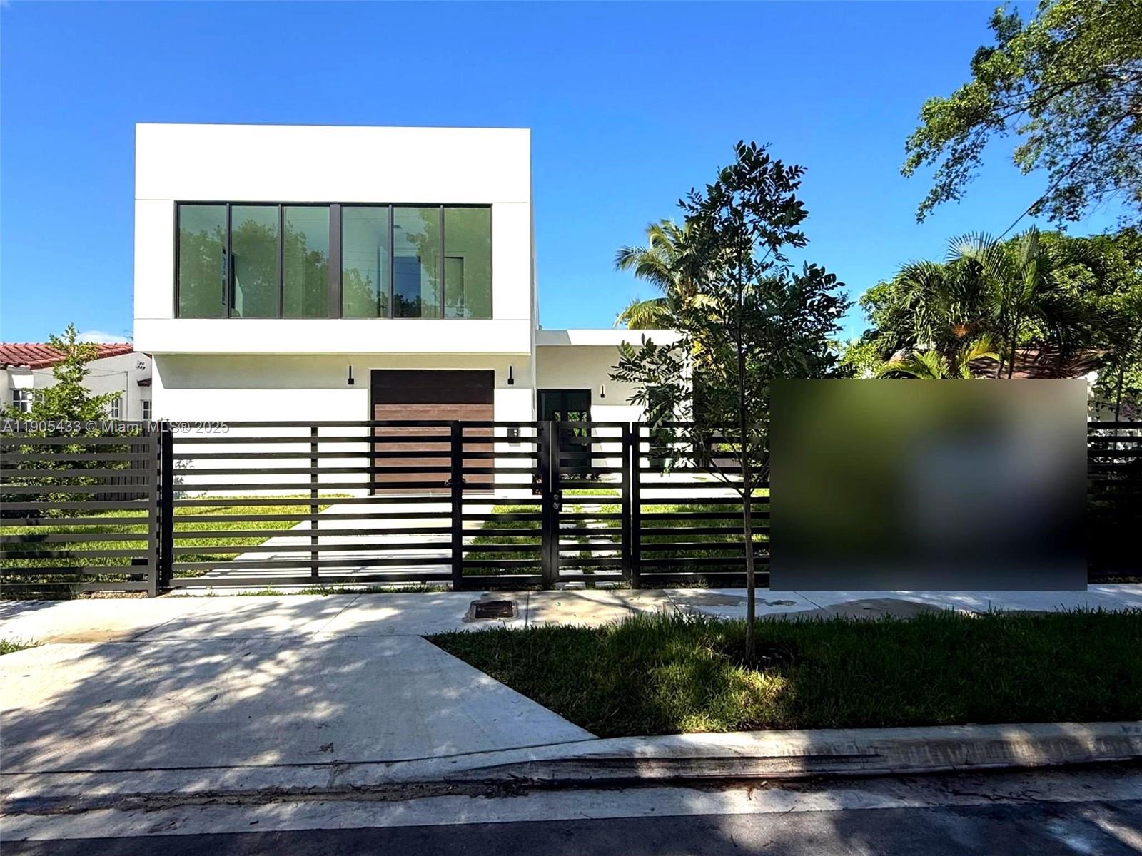 1259 Southwest 20th Street Miami, FL 33145 - Photo 60 of 61 a view of a house with a yard