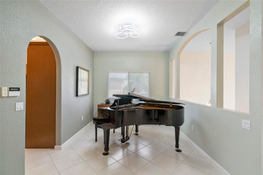 7847 Exeter Boulevard East, Unit 203 Tamarac, FL 33321 - Photo 14 of 36 a view of a workspace with furniture and a window