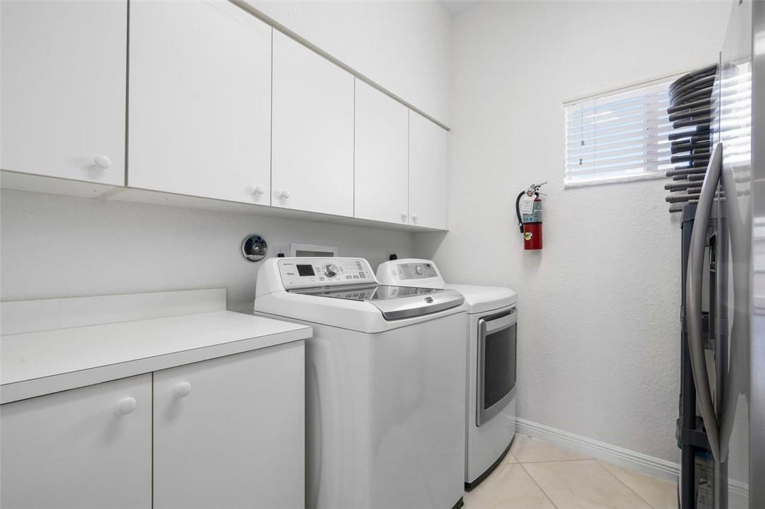7847 Exeter Boulevard East, Unit 203 Tamarac, FL 33321 - Photo 31 of 36 a utility room with dryer and washer