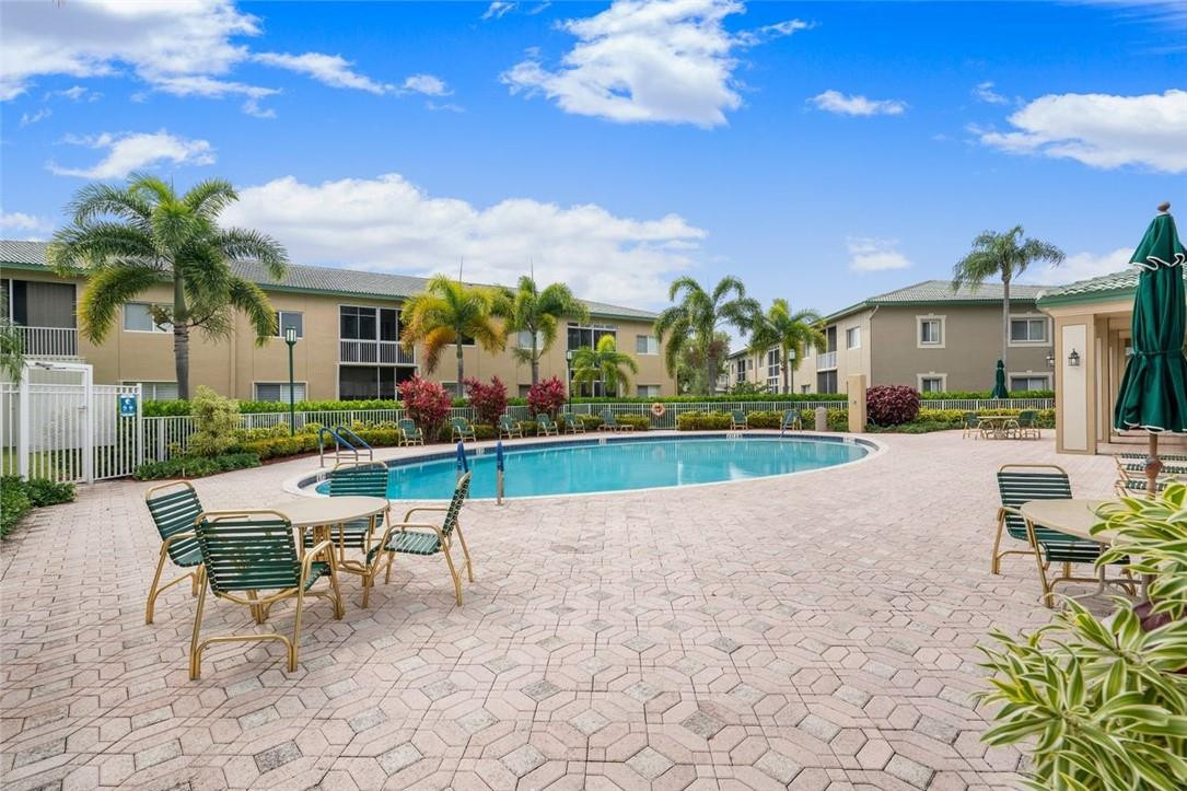 7847 Exeter Boulevard East, Unit 203 Tamarac, FL 33321 - Photo 34 of 36 a view of a house with backyard and sitting area