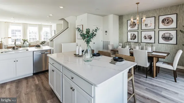 a kitchen with a table chairs stove and cabinets