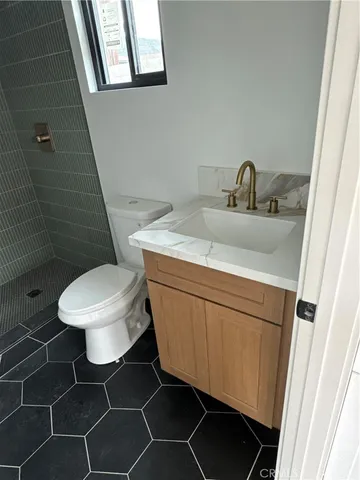 a bathroom with a toilet and a sink