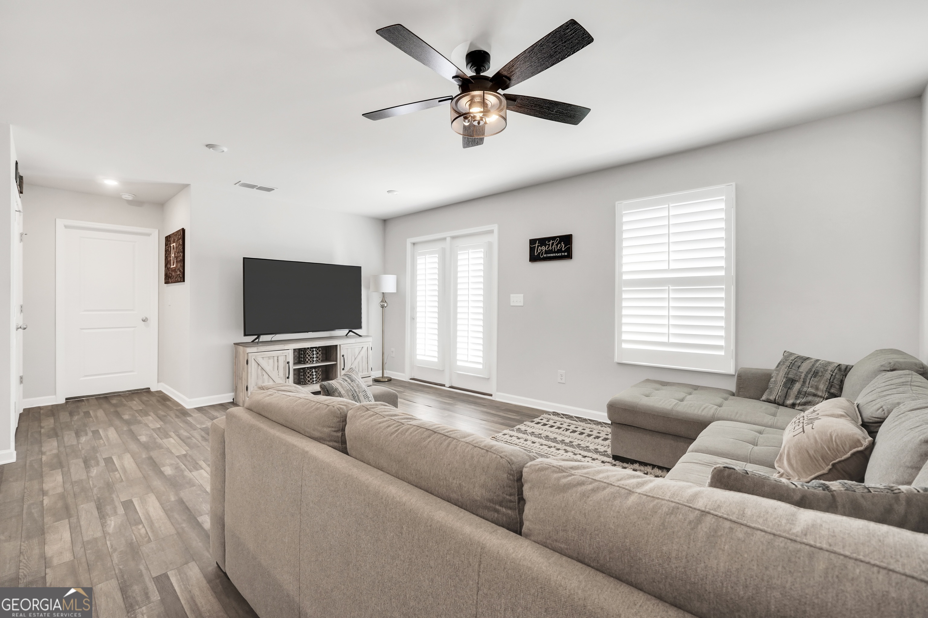 140 Catalpa Road Milner, GA 30257 - Photo 17 of 32 a living room with furniture and a flat screen tv