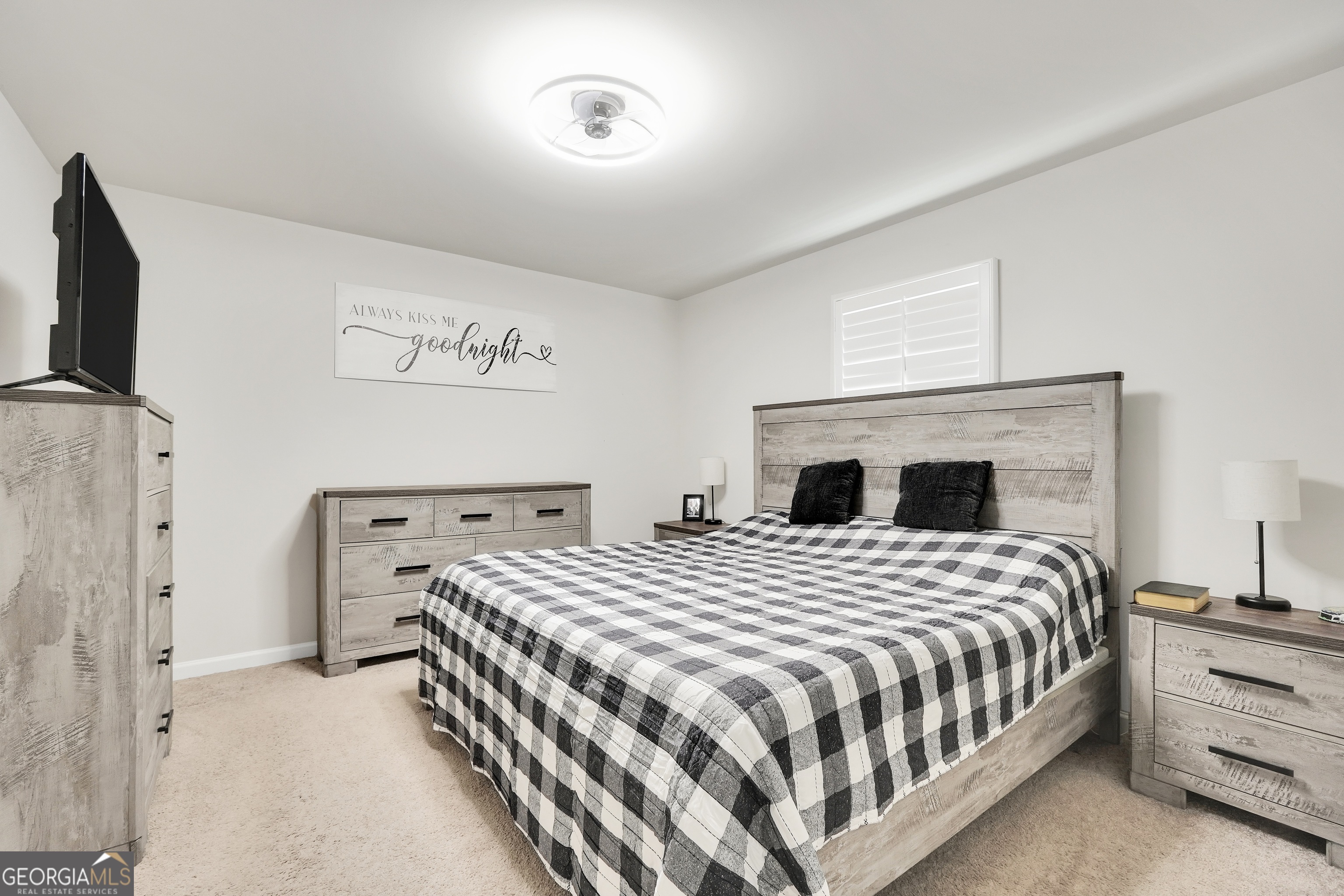 140 Catalpa Road Milner, GA 30257 - Photo 20 of 32 a bedroom with a bed and a fireplace