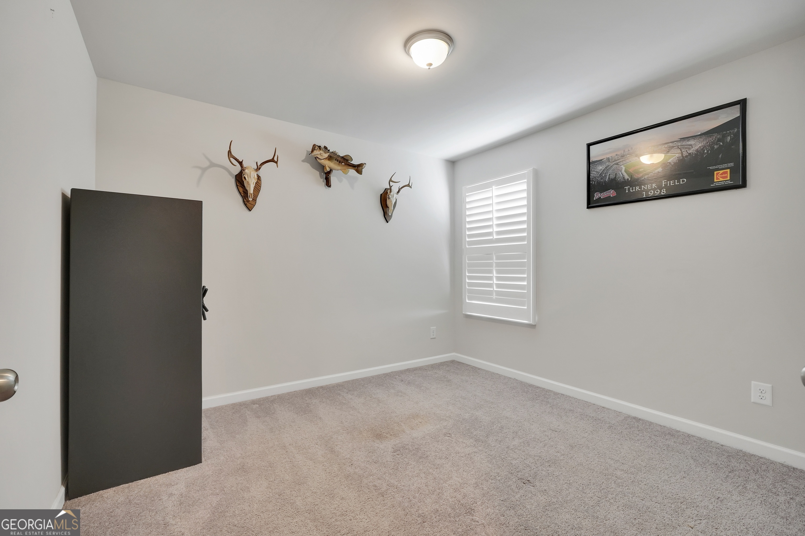 140 Catalpa Road Milner, GA 30257 - Photo 23 of 32 a view of an empty room with a window