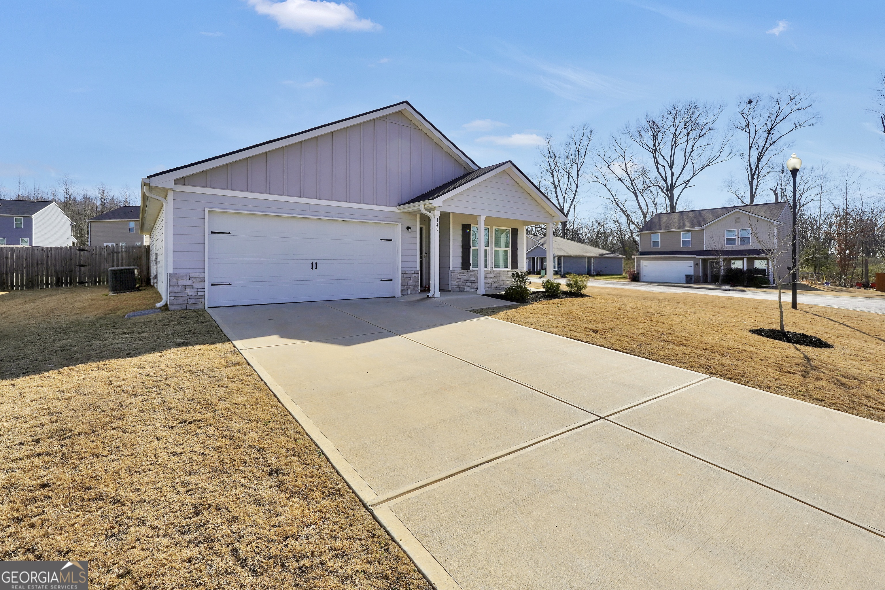 140 Catalpa Road Milner, GA 30257 - Photo 4 of 32 a front view of a house with a yard