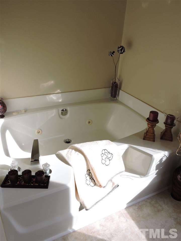 250 Kiser Hicks Road Roxboro, NC 27574 - Photo 12 of 19 a bathroom with a bathtub