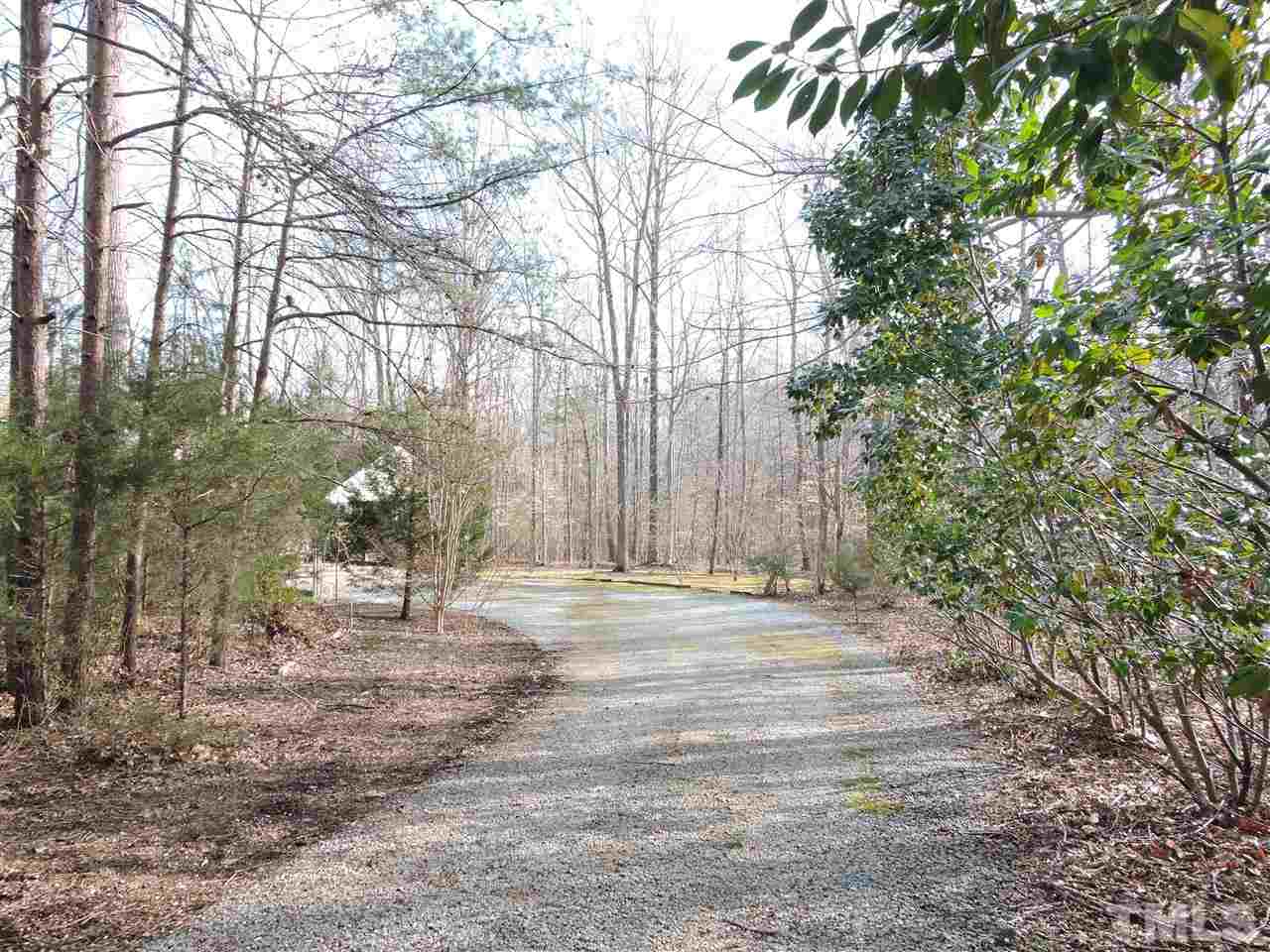 250 Kiser Hicks Road Roxboro, NC 27574 - Photo 17 of 19 a backyard of a house with lots of green space