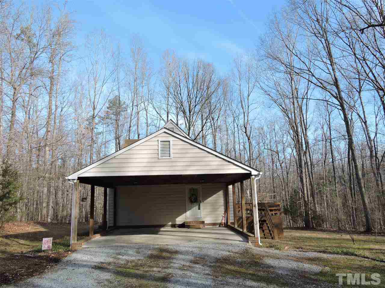 250 Kiser Hicks Road Roxboro, NC 27574 - Photo 18 of 19 a small garden covered with tall trees