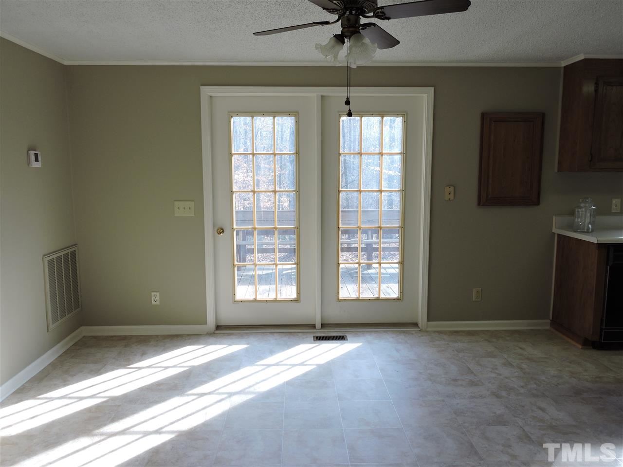 250 Kiser Hicks Road Roxboro, NC 27574 - Photo 8 of 19 a view of an empty room with a window