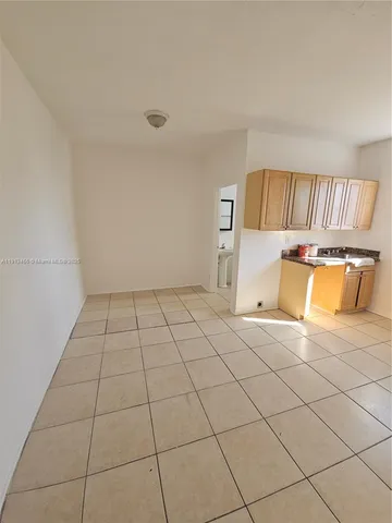 a room with a washing machine and a window