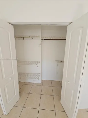 a view of an empty walk in closet